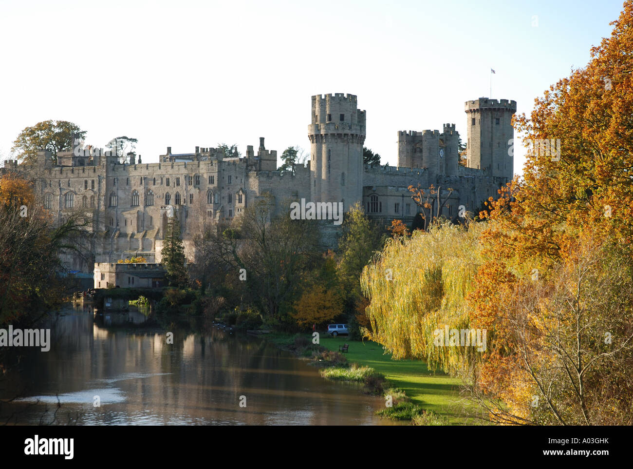 Warwick Castle and River Avon in autumn, Warwickshire, England, UK ...