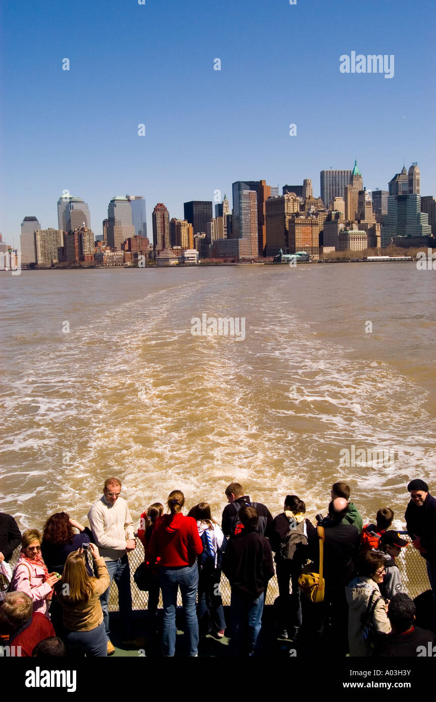 New York City New York Ferry from Castle Clinton to Statue of Liberty and Ellis Island showing skyline of New York post 9-11. Stock Photo