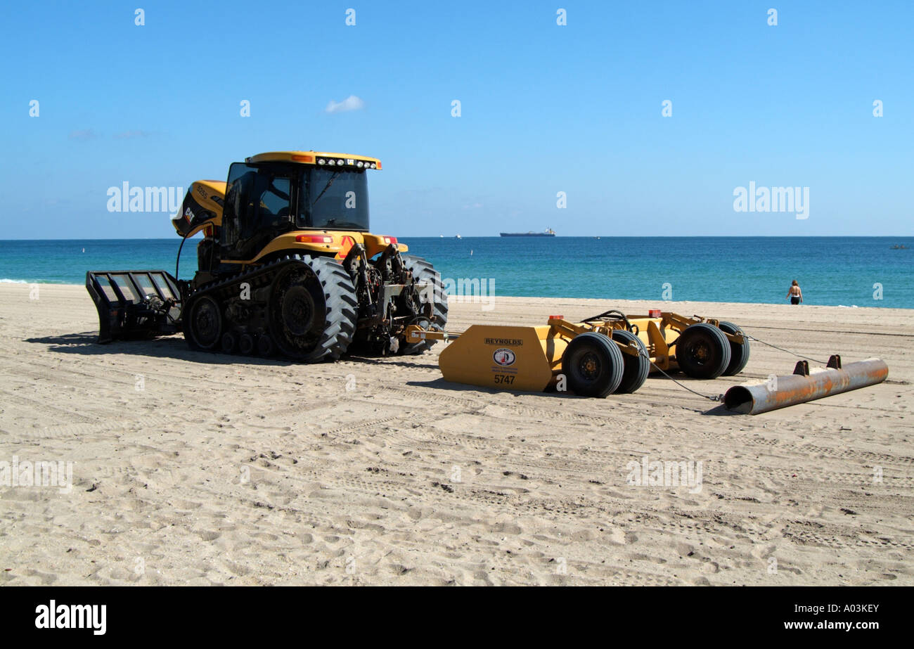Beach maintenance tractor cleaning shoreline Fort Lauderdale Florida USA A  CAT tractor pulling a Reynolds sand rake Stock Photo - Alamy