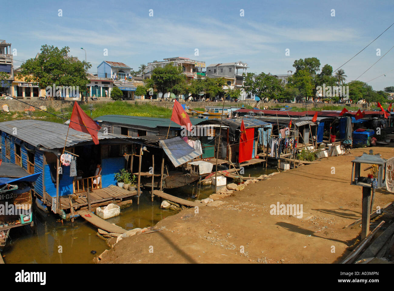 Poor Hue people live in Sampans settlements located on the shores of a Canal leading to the Perfume river Vietnam Stock Photo