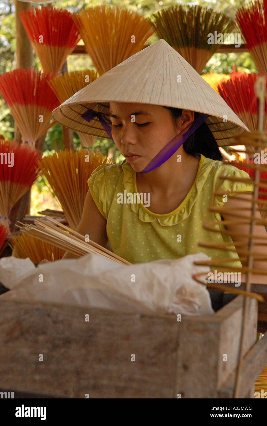Worker rolling incense sticks Tu Duc Village Central Vietnam Stock