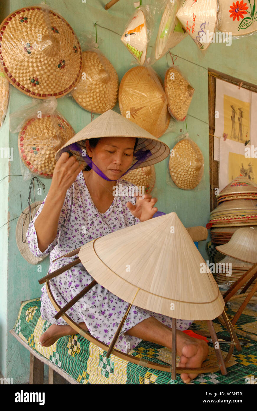 Woman making Conical hat in the village of Tu Duc Central Vietnam Stock Photo