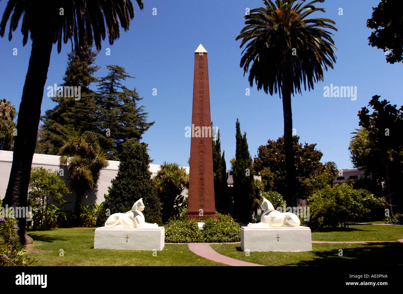 Obelisk flanked by Sphinx statues in gardens at Egyptian museum in Rosicrucian park, San Jose