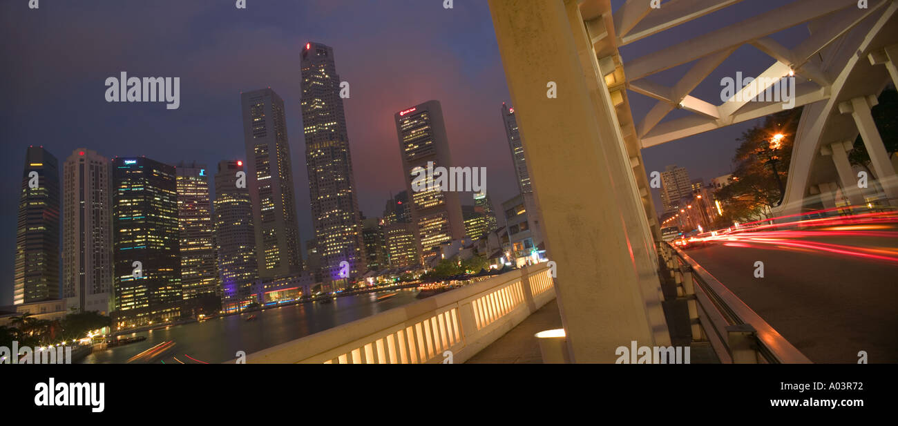 View of the skyscrapers along The Singapore River from Elgin Bridge at dusk. Stock Photo