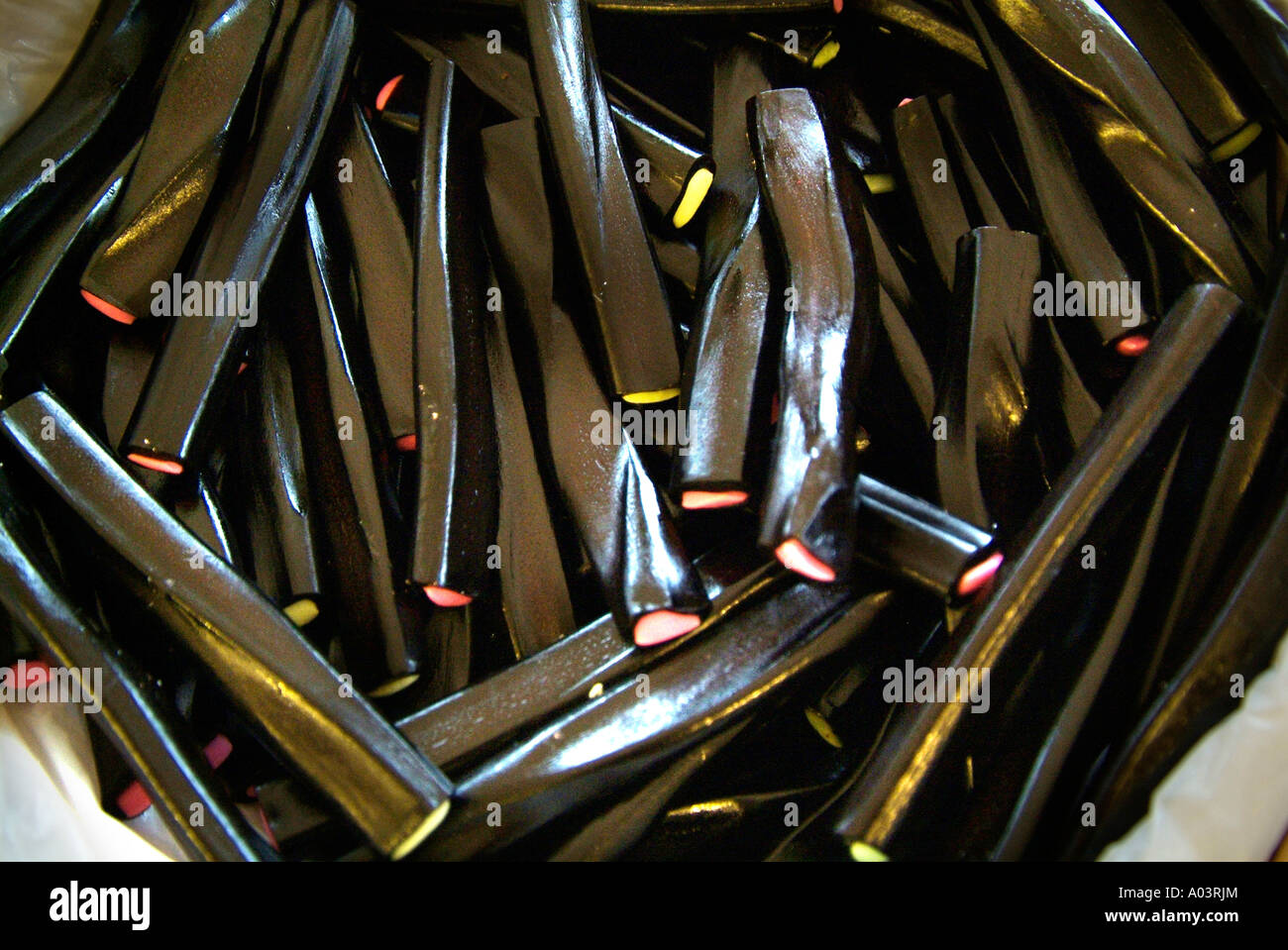 Liquorice licorice black candy special confectionary laxative close up macro loose pile soft chewy confectionary food edible Stock Photo