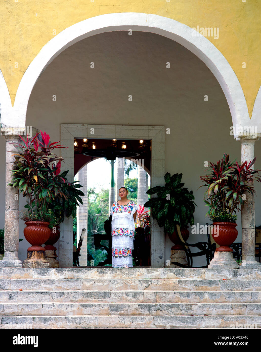 A staff member stands at the entrance to the Hacienda Chichen, a hotel in Chichen Itza in Mexico. Stock Photo