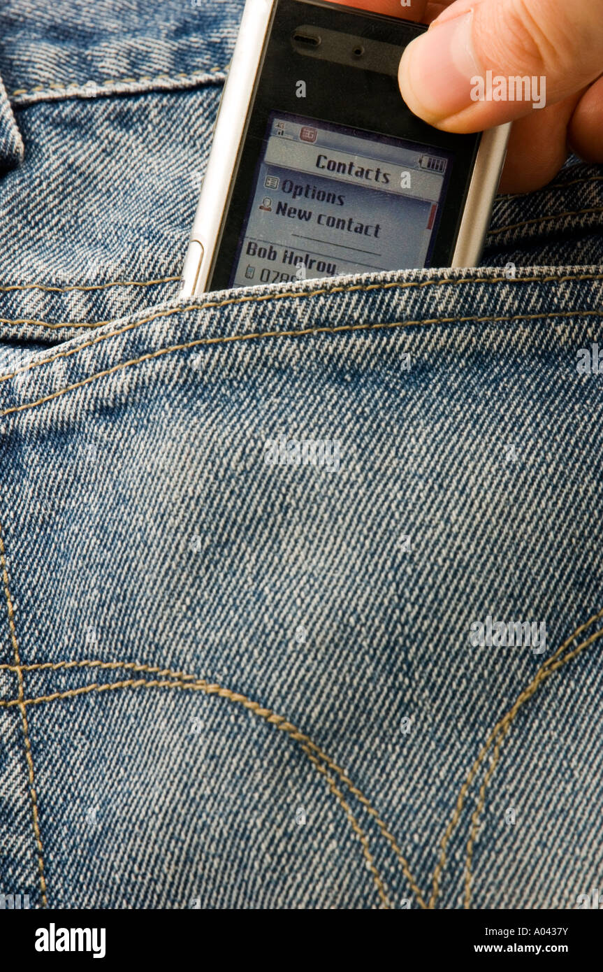 mobile phone in back pocket of a pair of jeans Stock Photo - Alamy