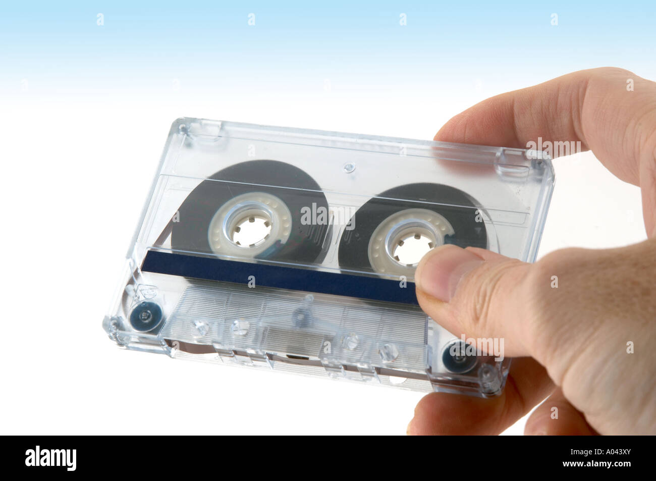 close up of a hand with a compact cassette Stock Photo