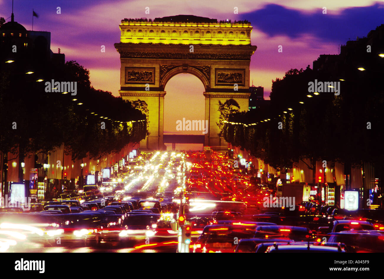 Avenue des Champs Elysees and Arc de Triomphe at night, Paris Stock Photo -  Alamy