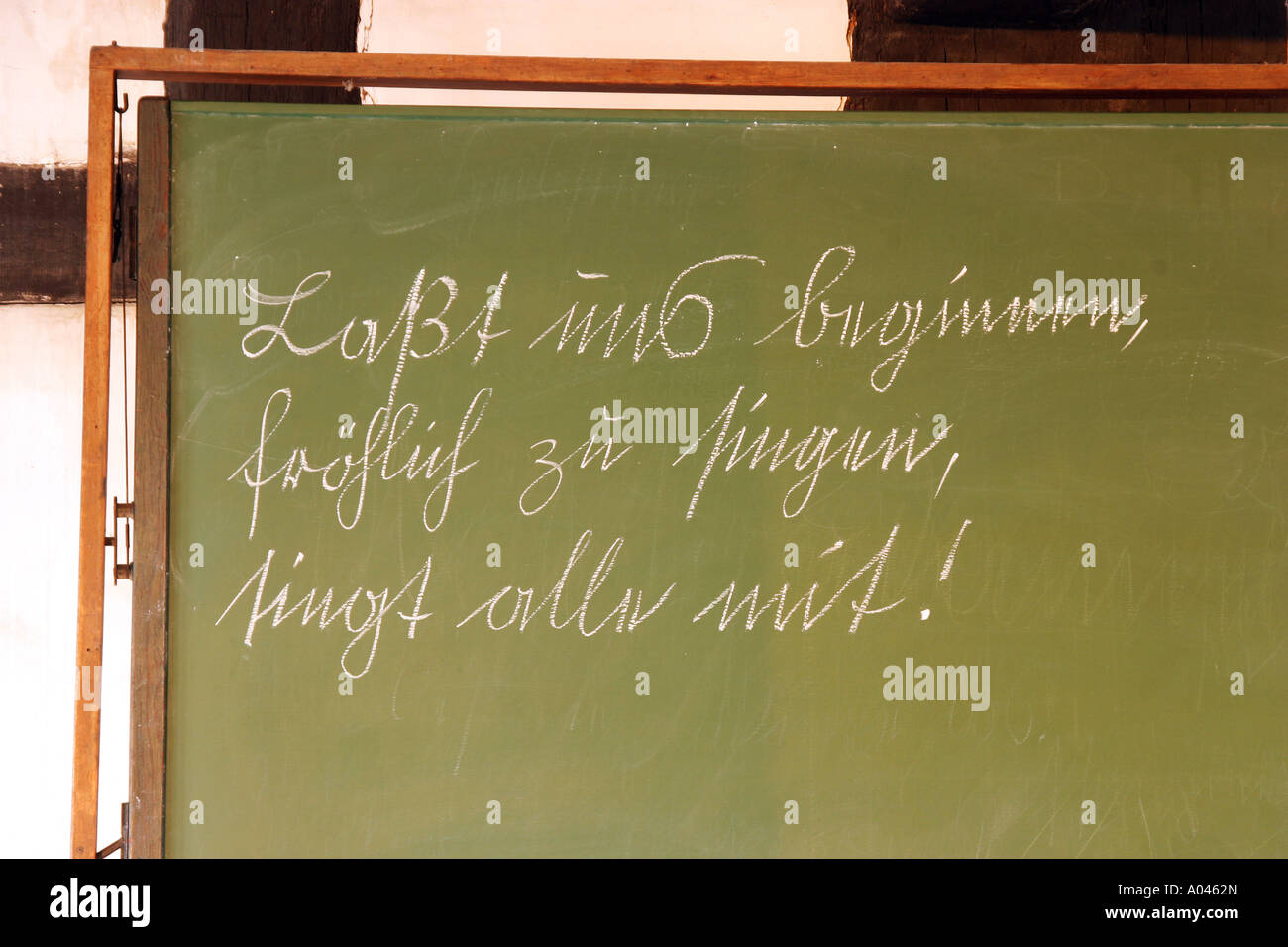 Ancient school-blackboard with inscription in blackletter handwriting Stock Photo
