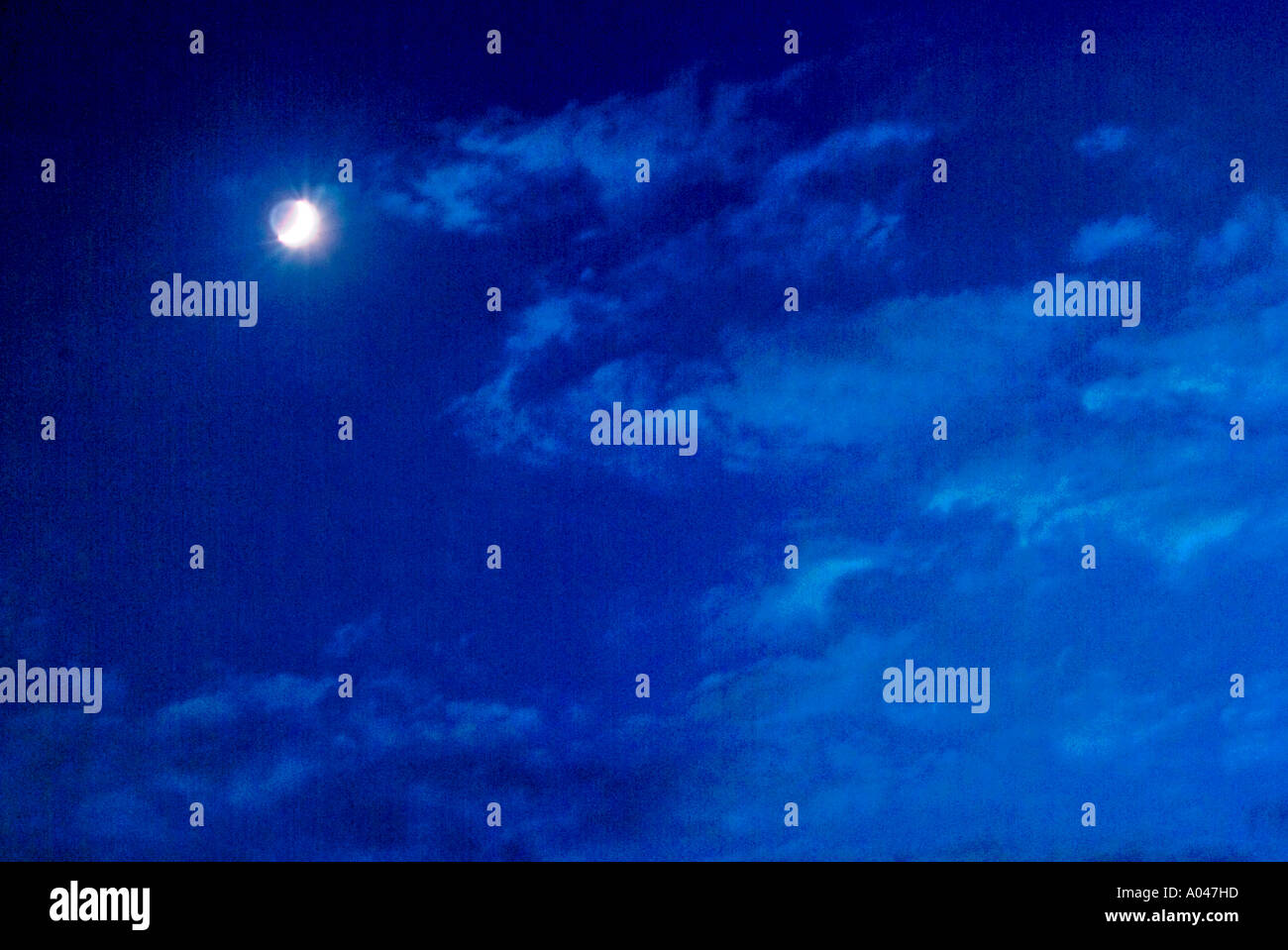 Dark blue evening sky with full moon and clouds Stock Photo - Alamy
