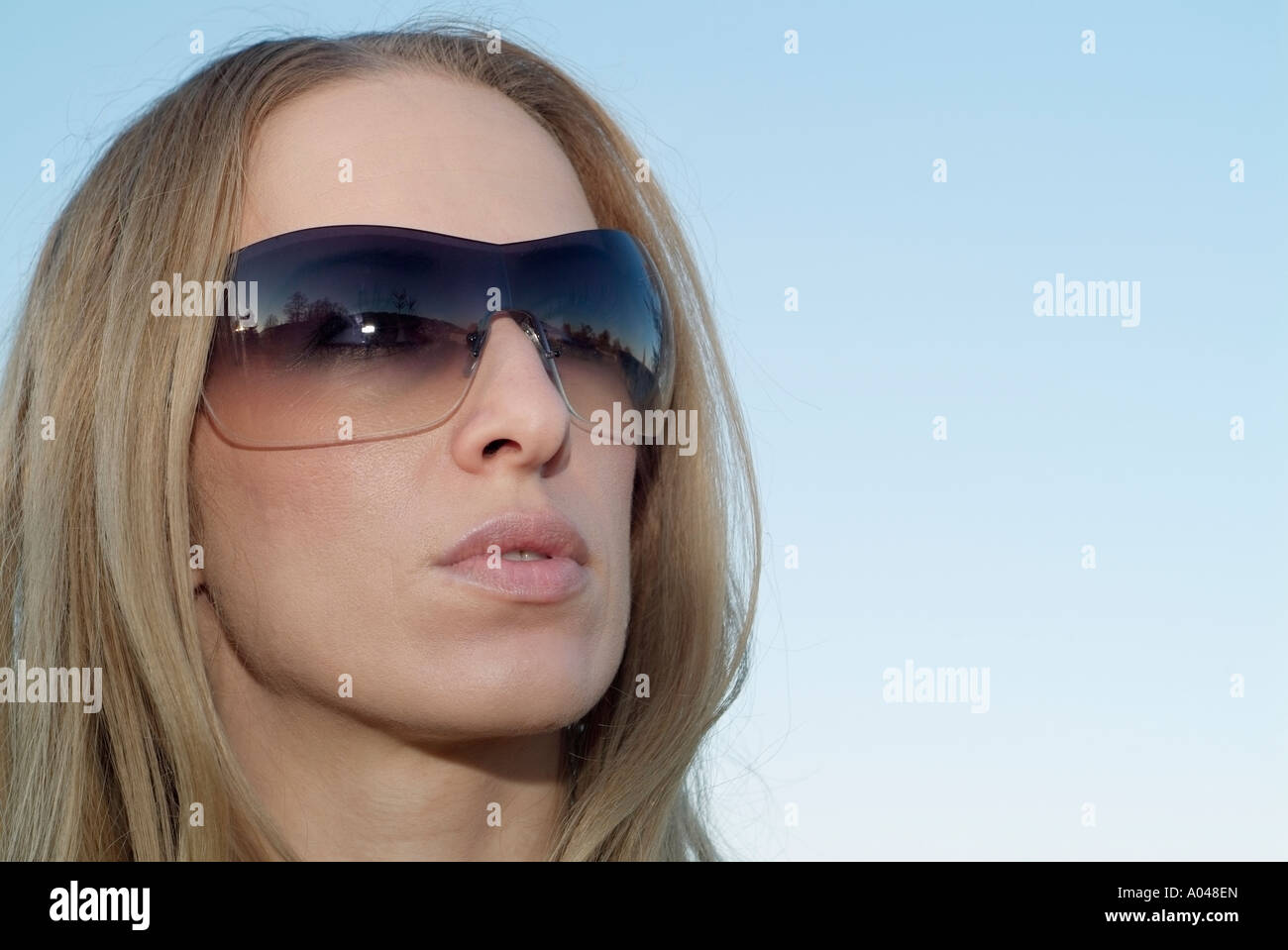 Woman Wearing Sunglasses Close Up Face Shot Stock Photo