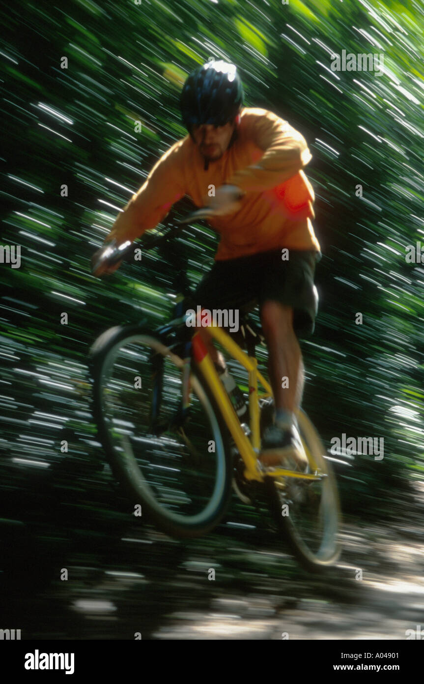Young man riding a mountain bike off road Stock Photo Alamy