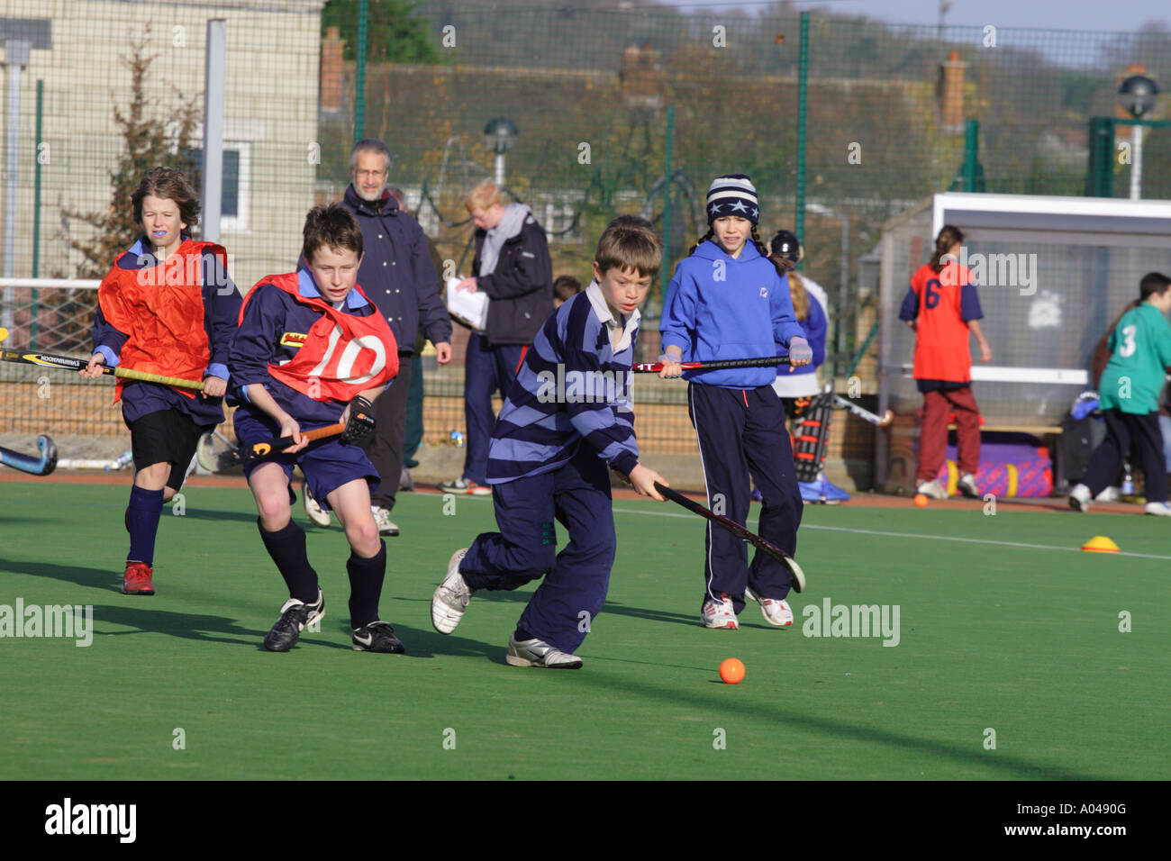 Youth field hockey match mixed gender with both boy and girl team