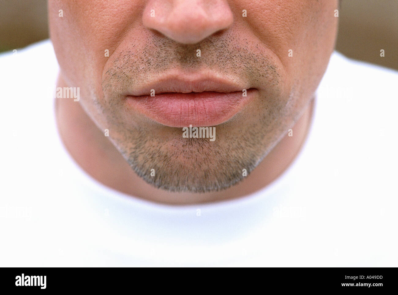 Close up portrait of the lower half of a man's face  showing his nose  mouth and chin Stock Photo