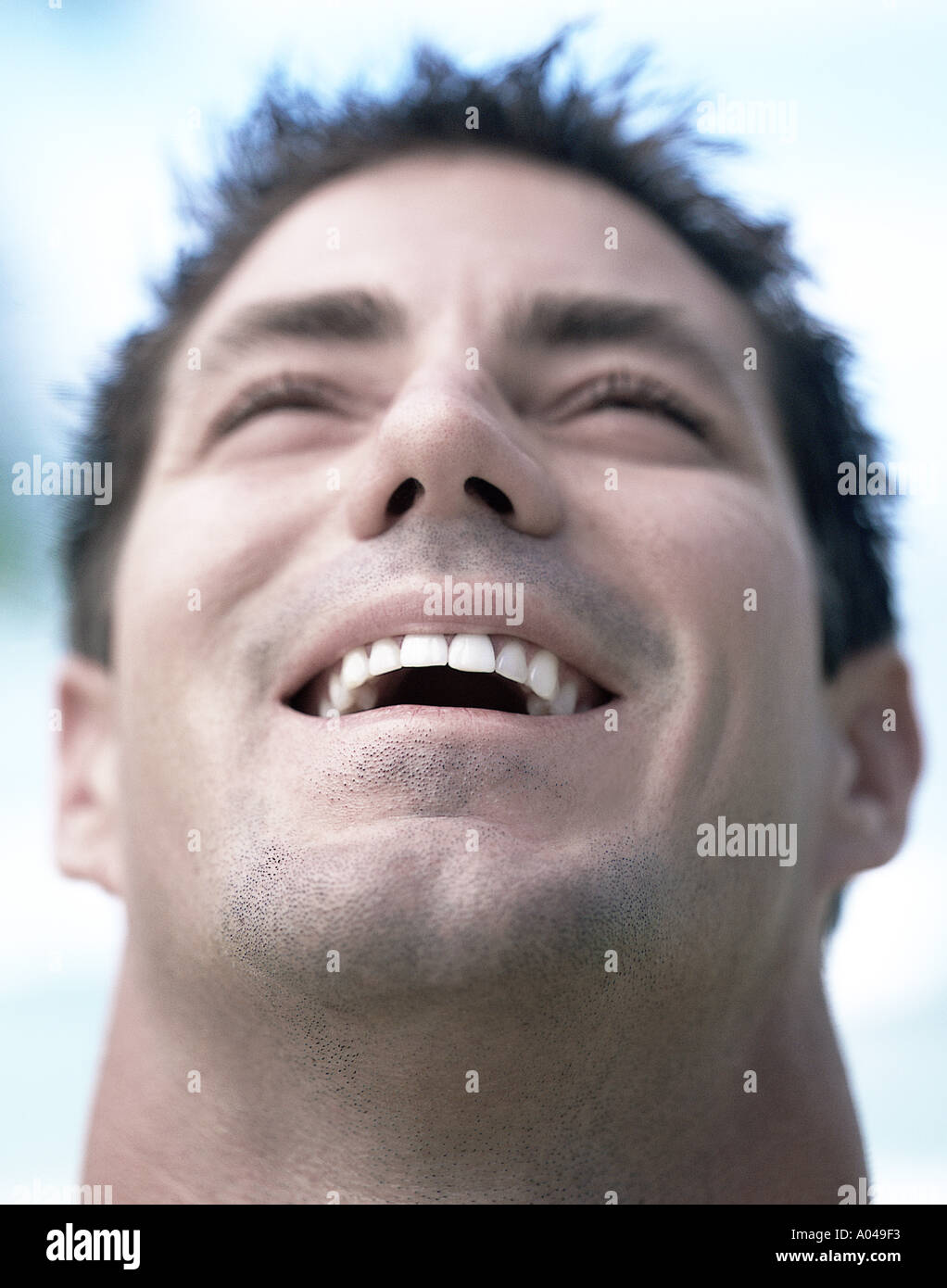 Portrait of a young man laughing Stock Photo