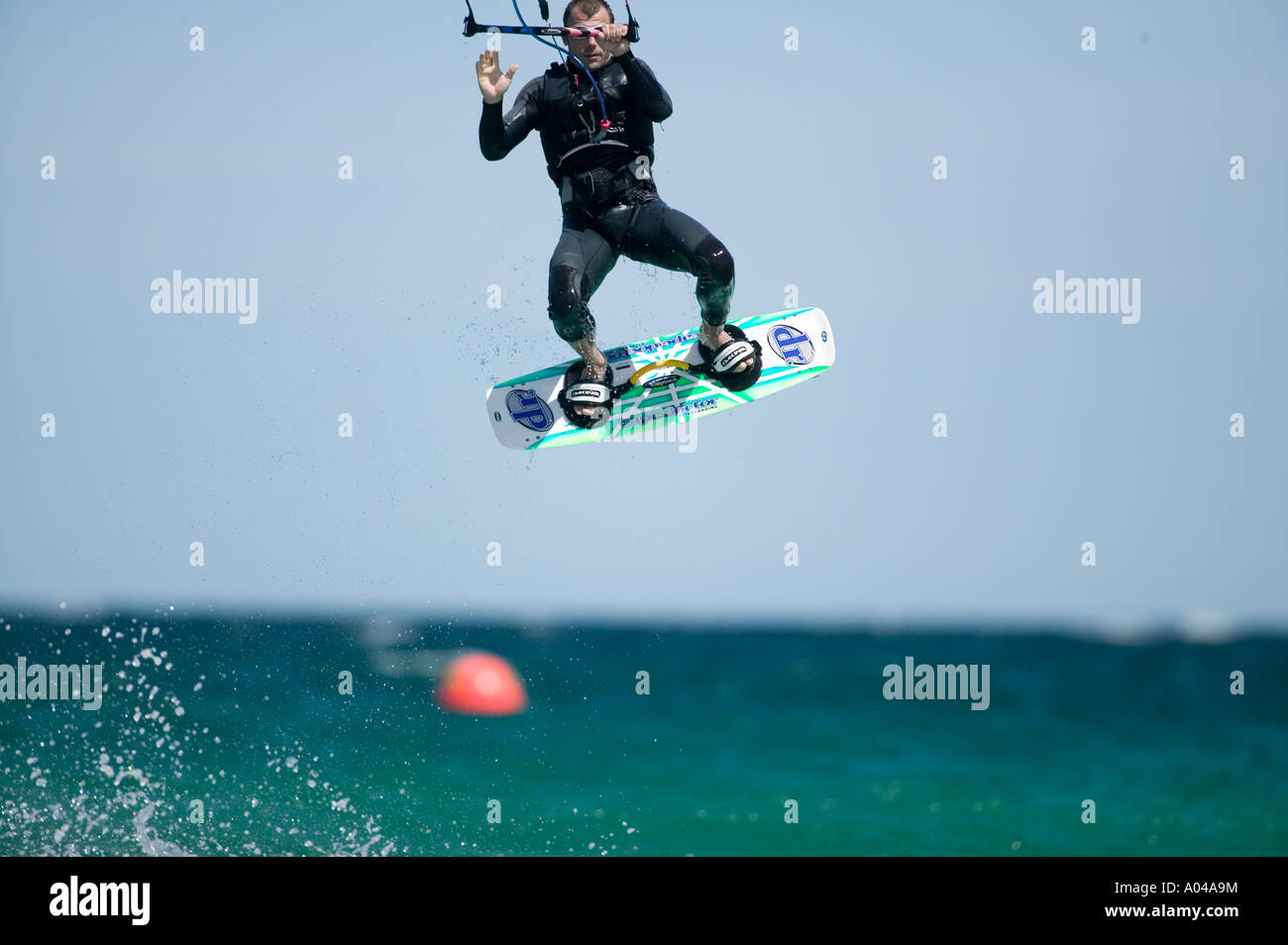 South Africa Western Cape Province Cape Town MR Kite surfer rides through breaking waves at Fish