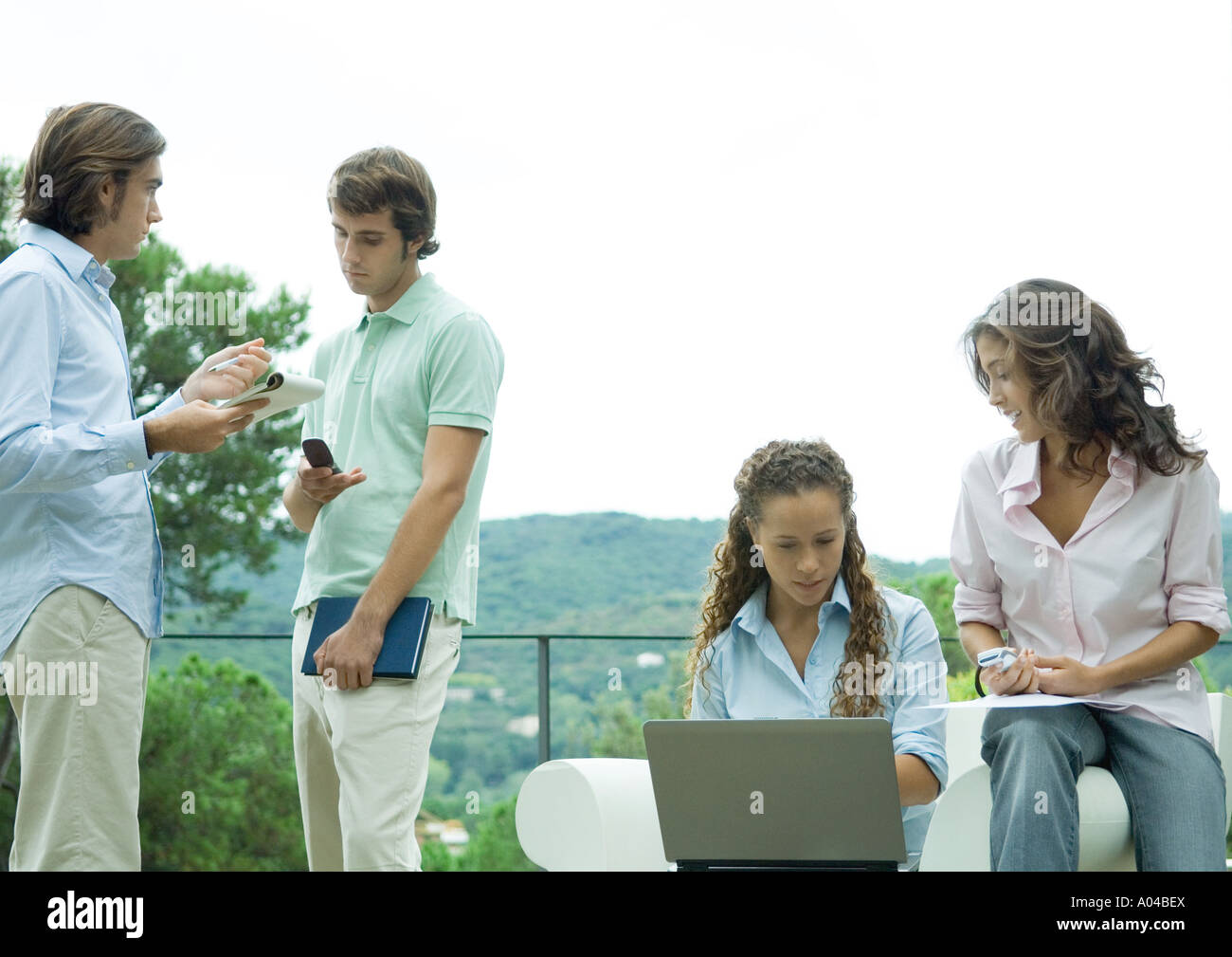 Casually dressed young executives working outdoors Stock Photo