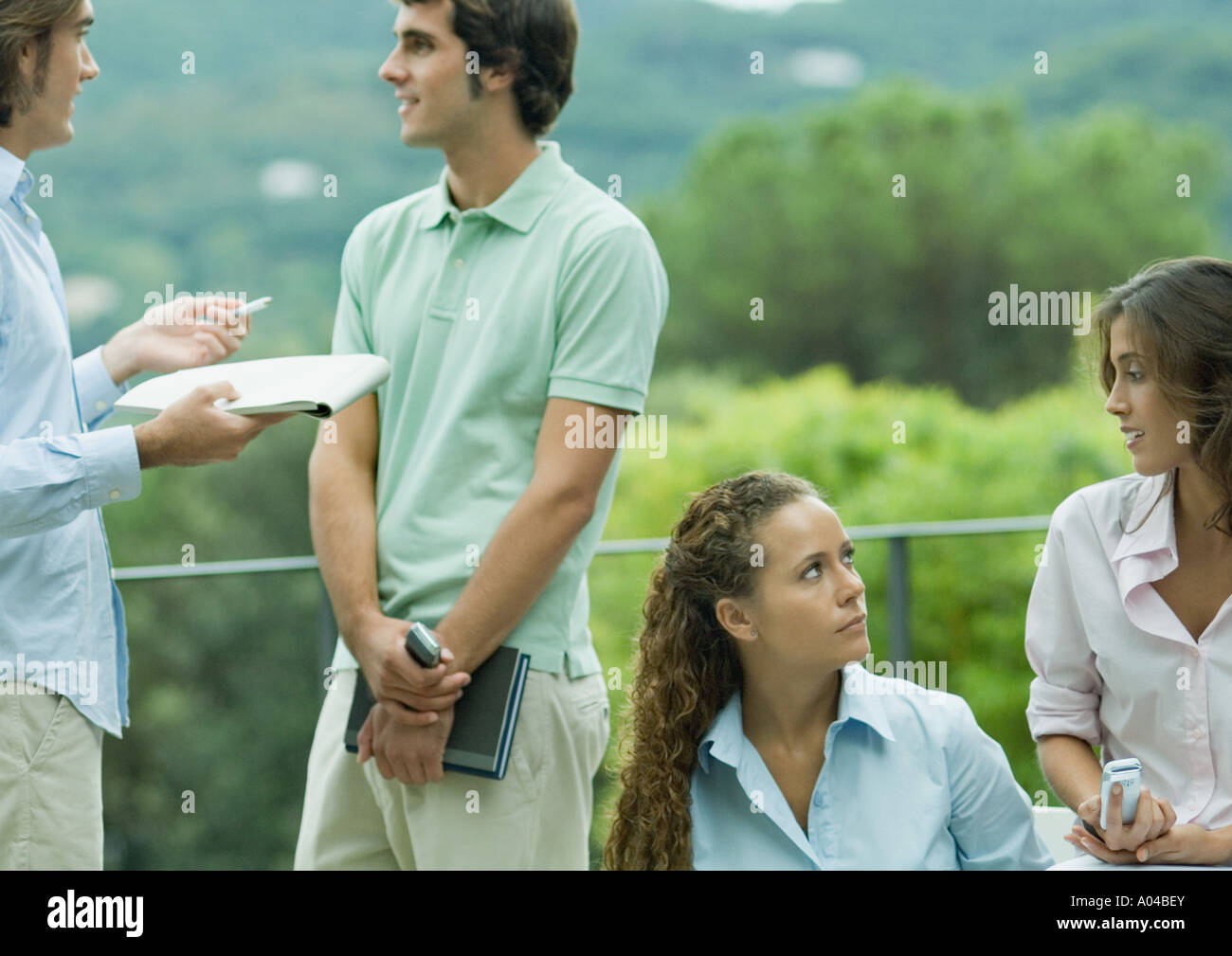 Casually dressed young executives working outdoors Stock Photo