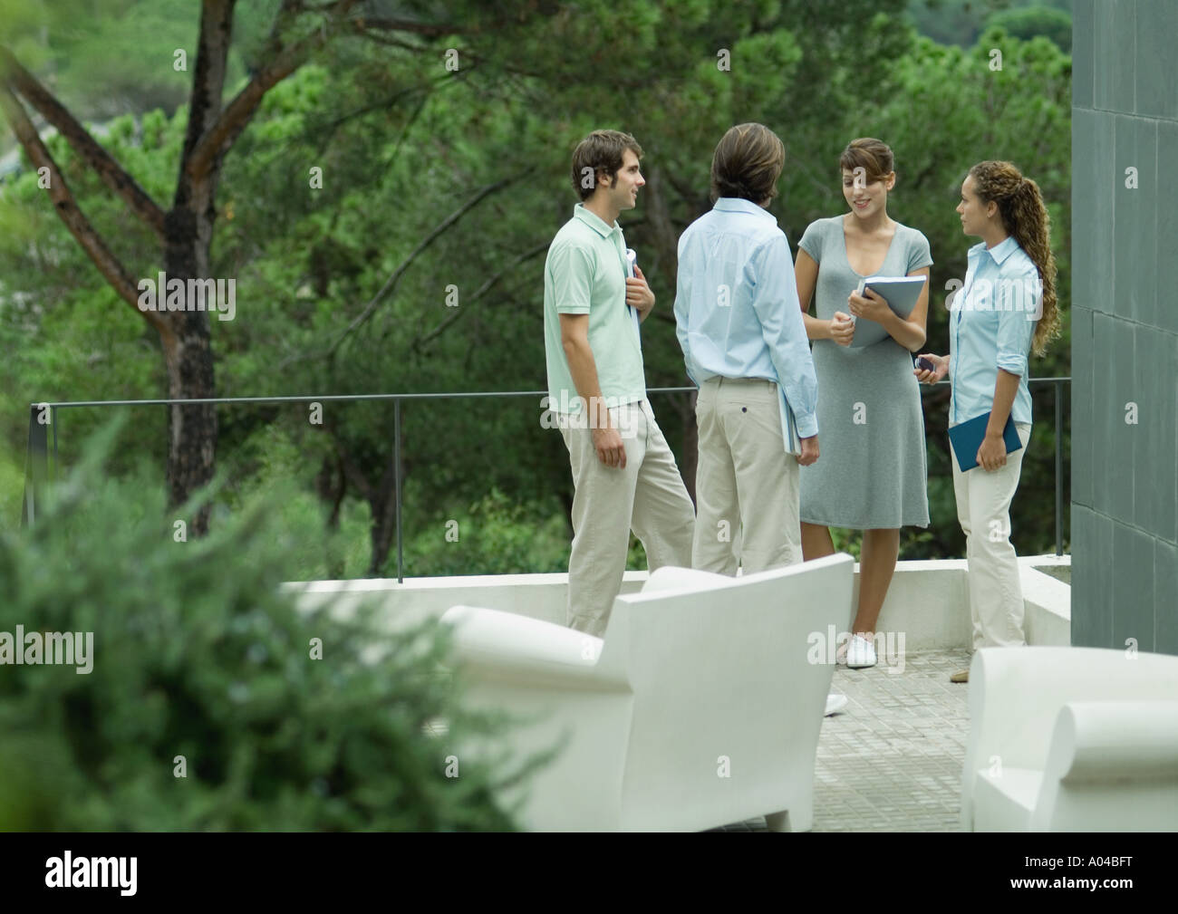 Casually dressed young executives working outdoors Stock Photo