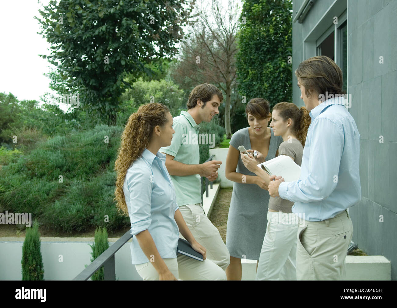 Casually dressed young executives working outdoors Stock Photo