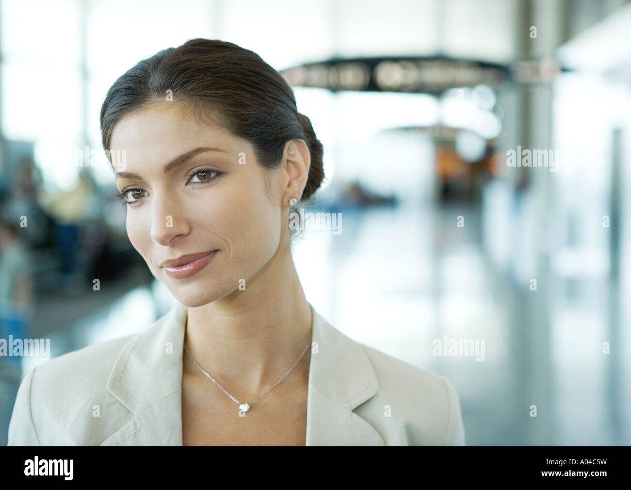 Woman in airport Stock Photo - Alamy