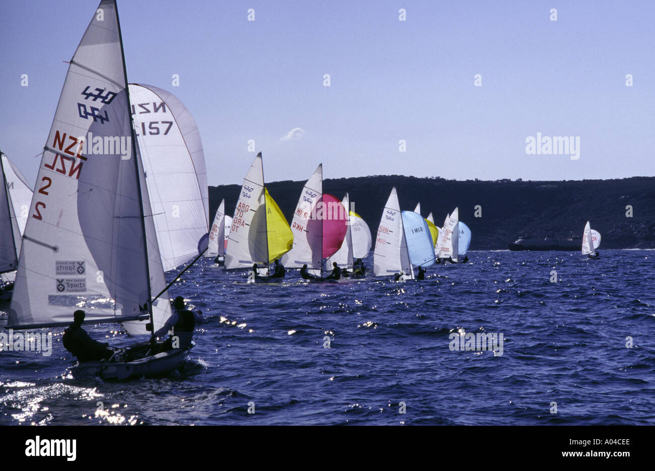Olympic class 470 yachts sail on Sydney Harbour Stock Photo