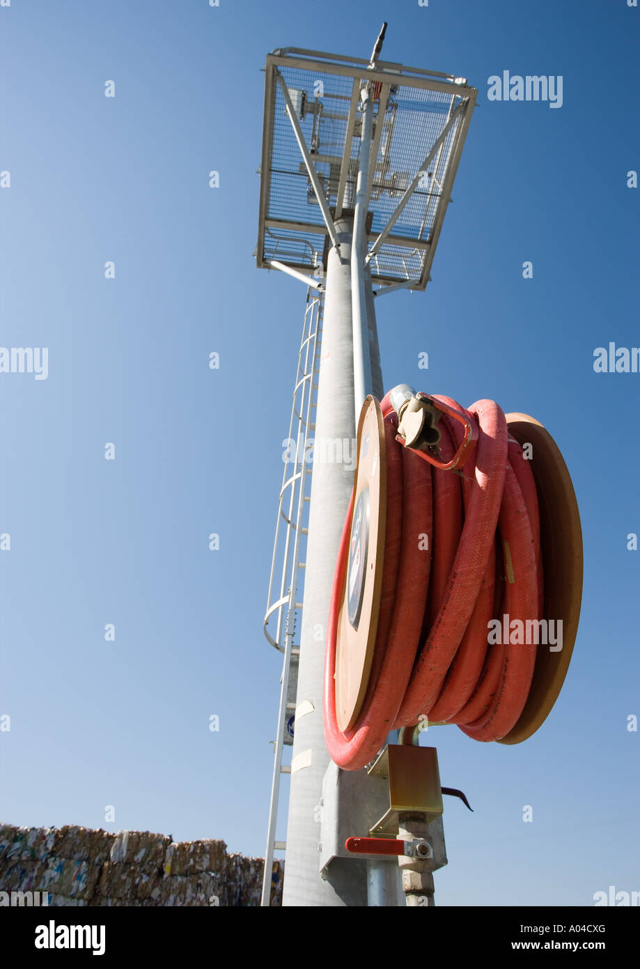 Rolled up fire hose hi-res stock photography and images - Alamy
