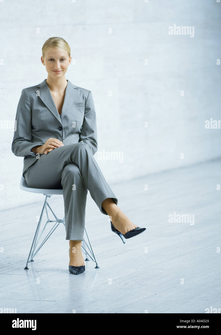 Woman sitting chair full length hi-res stock photography and images - Alamy