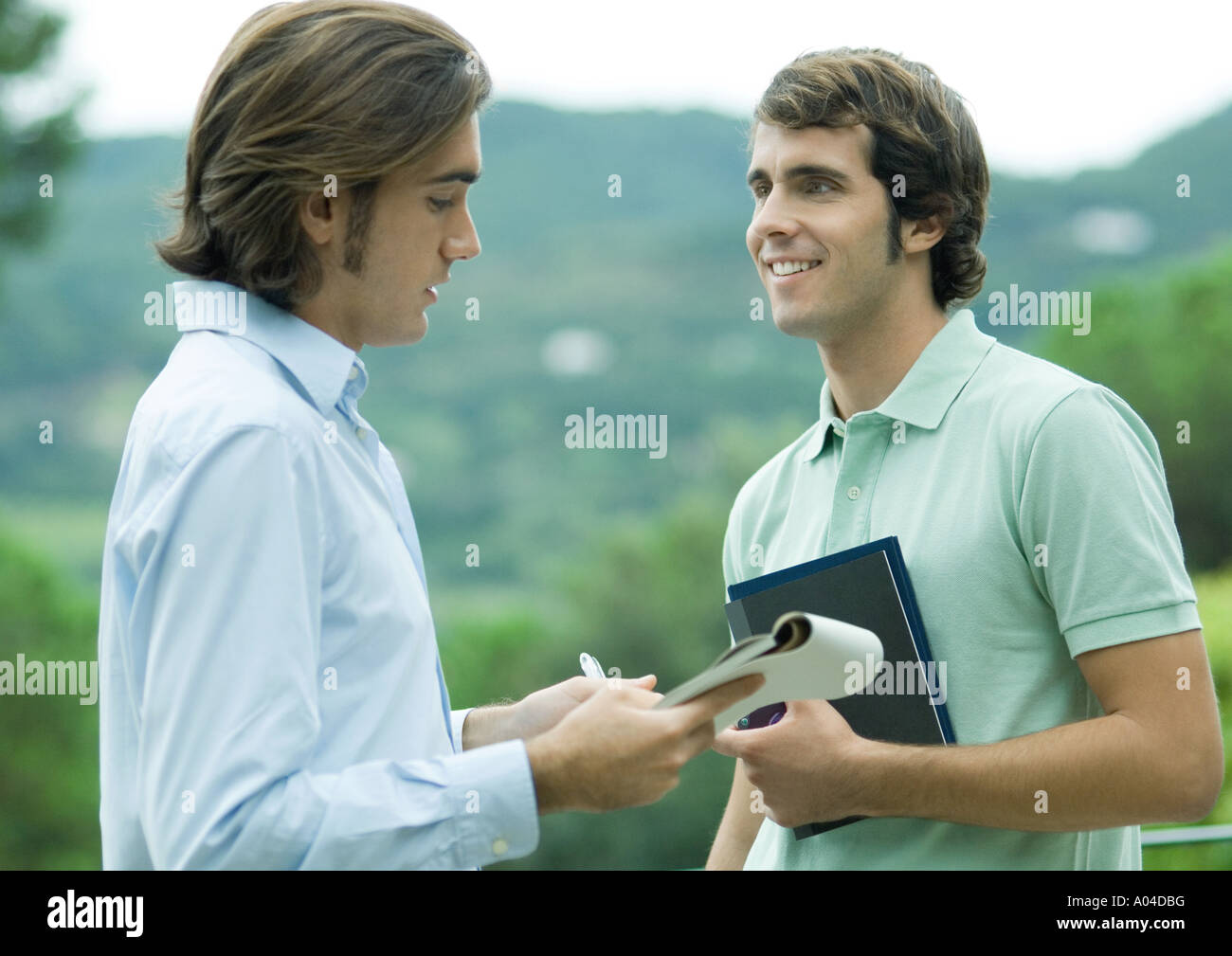 Casually dressed young executives working outdoors Stock Photo