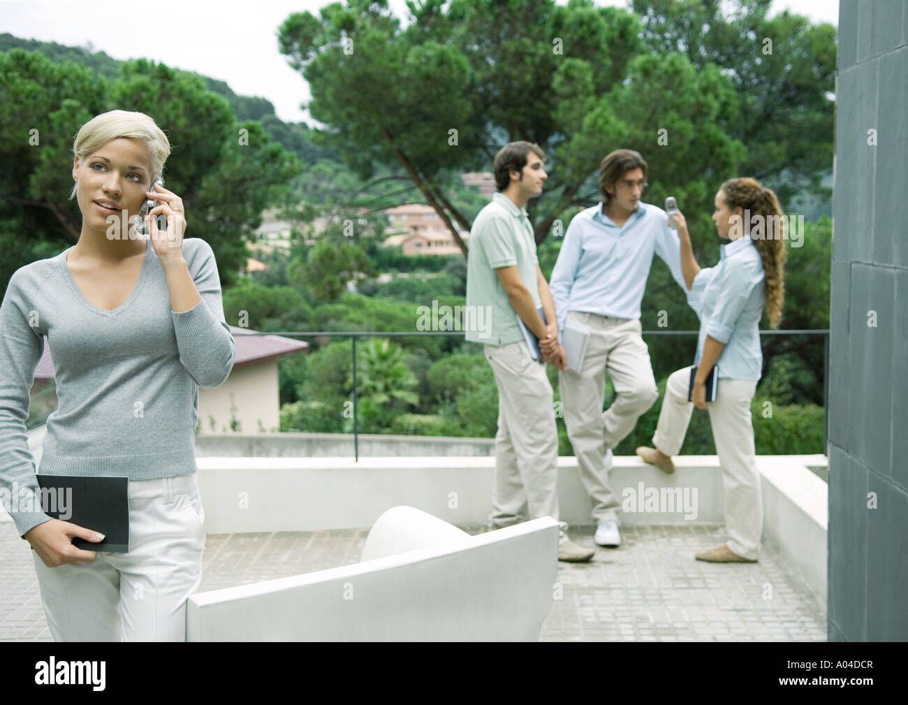 Casually dressed young executives working outdoors Stock Photo