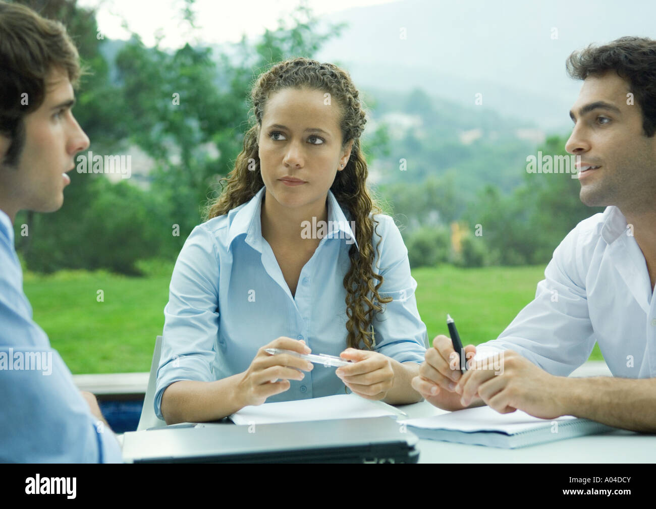 Casually dressed young executives working outdoors Stock Photo