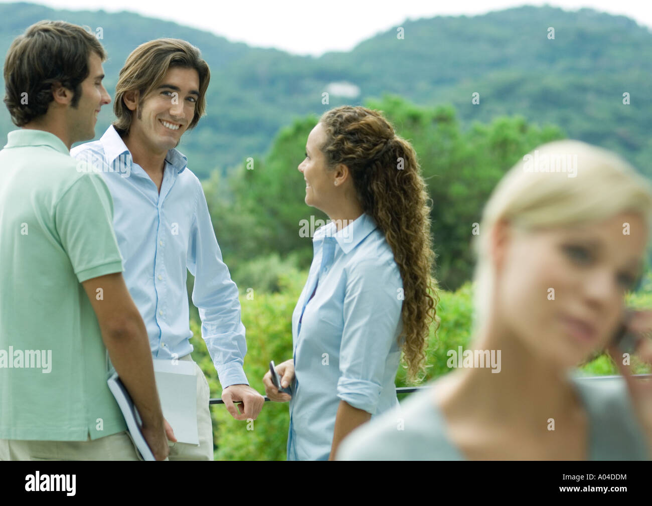 Casually dressed young executives working outdoors Stock Photo
