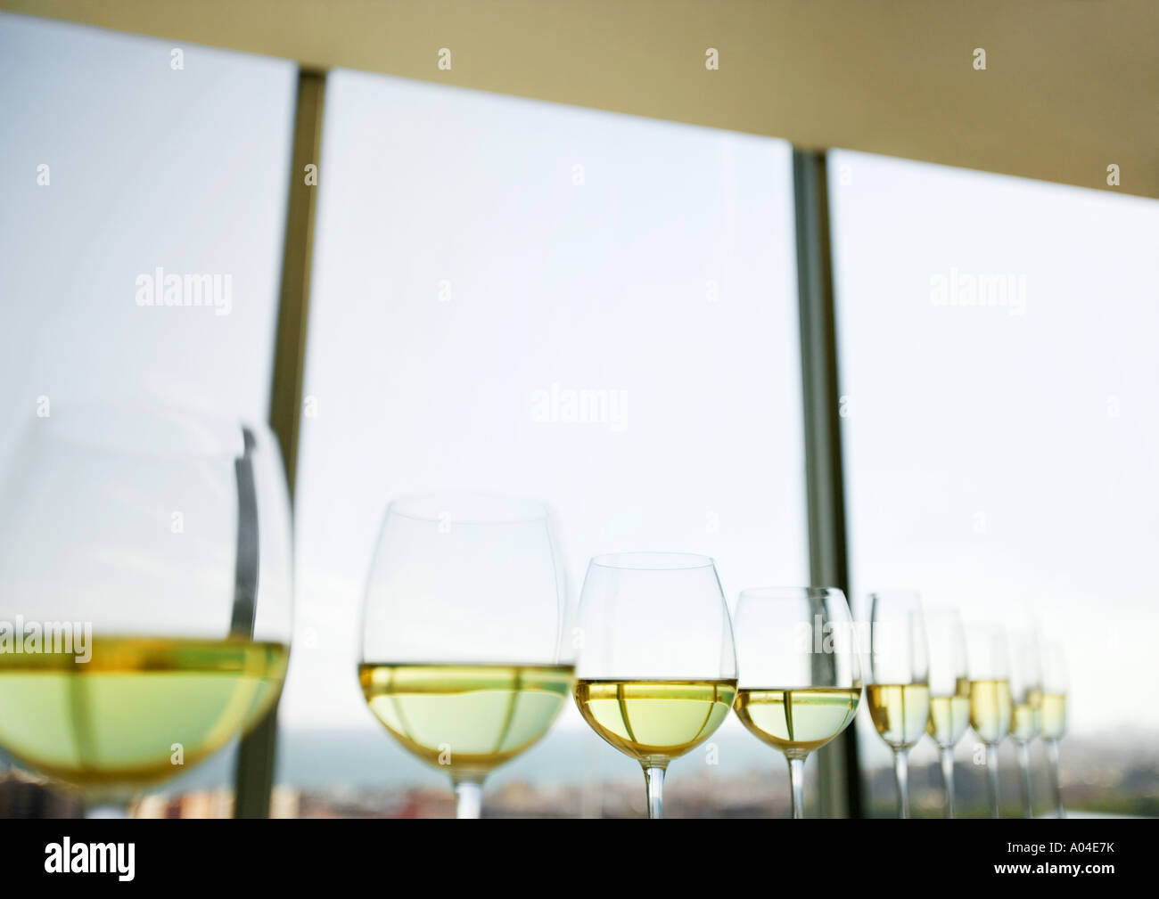 Halffilled wine and champagne glasses lined up Stock Photo Alamy
