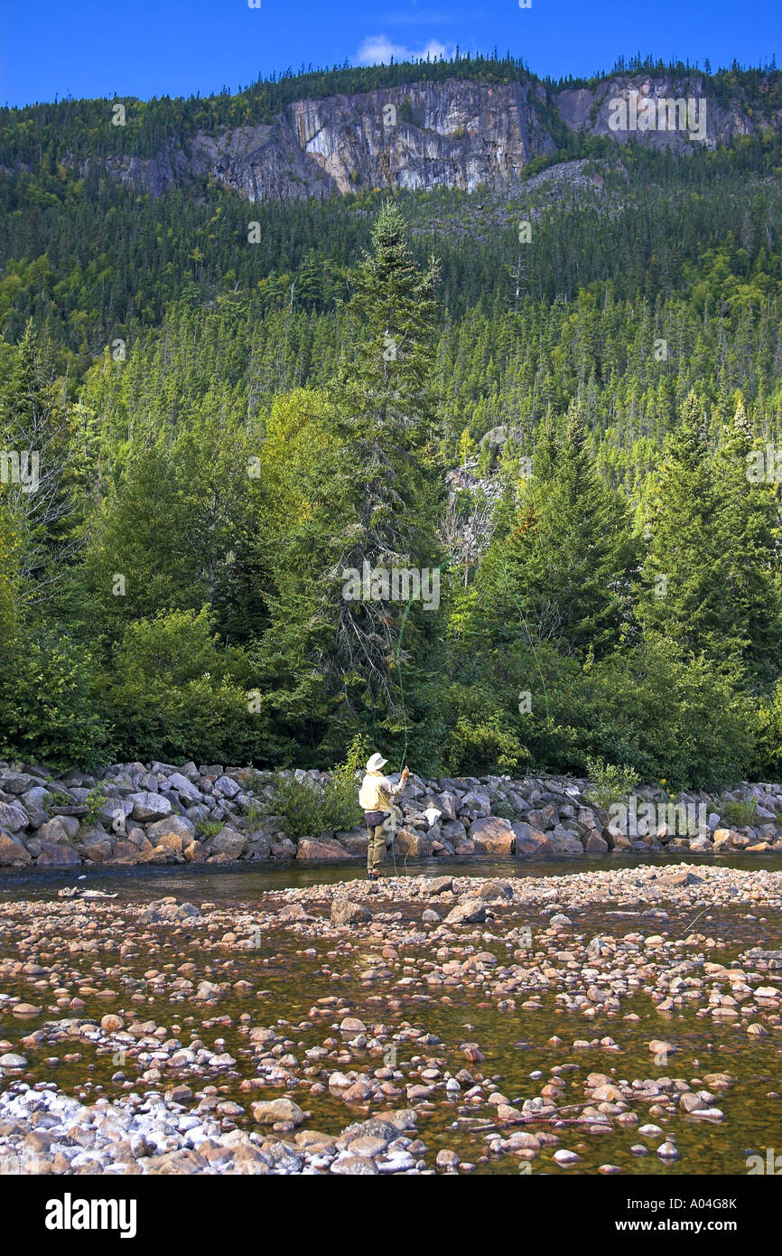 Flyfisherman fishing atlantic salmon in Ste-Marguerite river Quebec Canada. Stock Photo