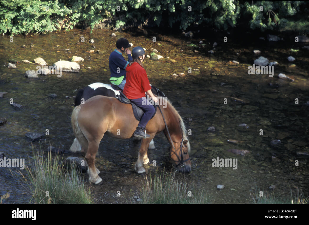 Horse riding in Doone Valley rider stops for horses to drink from