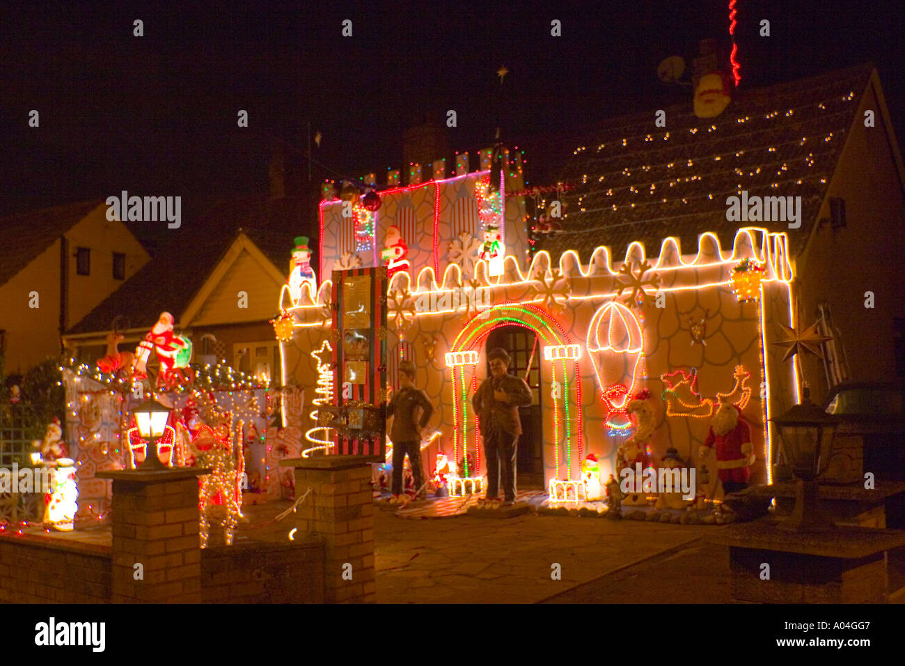 A private home and garden illuminated with Christmas lights in Harold