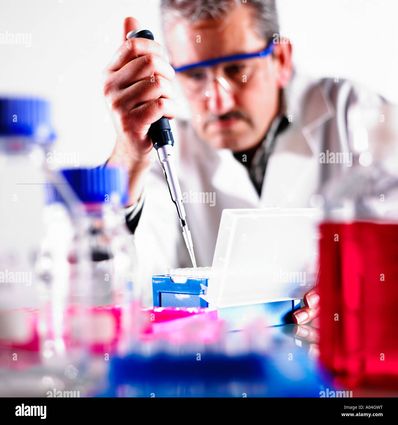 Group of Beakers,Pipettes,Test Tubes Etc on Table with Scientist Stock Photo Alamy