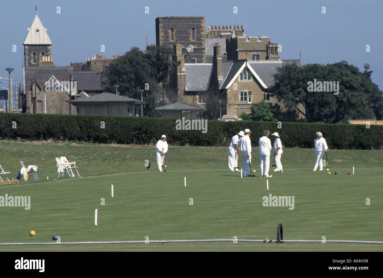 Ramsgate Croquet Club players taking part in a game on grass playing