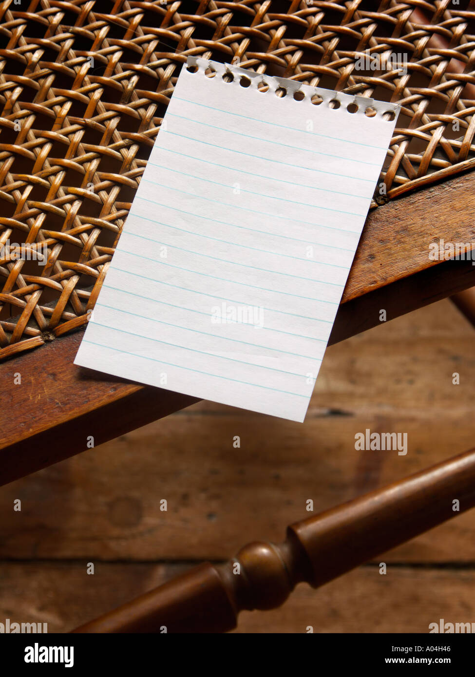 A blank note on a chair Stock Photo