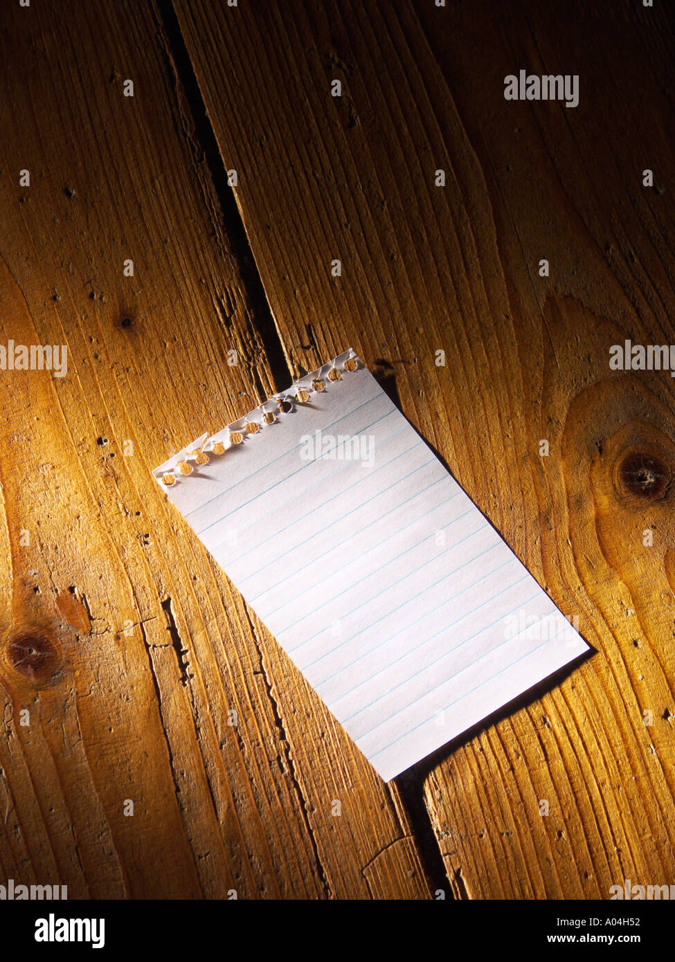 Blank note dropped on floor Stock Photo