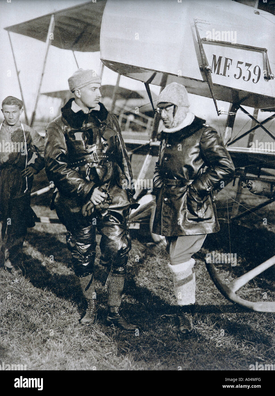 Italian poet, writer, aviator, Gabriele D'Annunzio, 1863 -1938, seen here on the right,  during his service with the Italian Air Force. Stock Photo