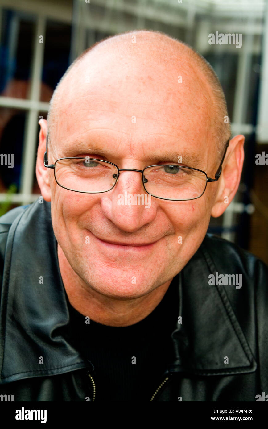 Cool looking older man with shaven head Stock Photo