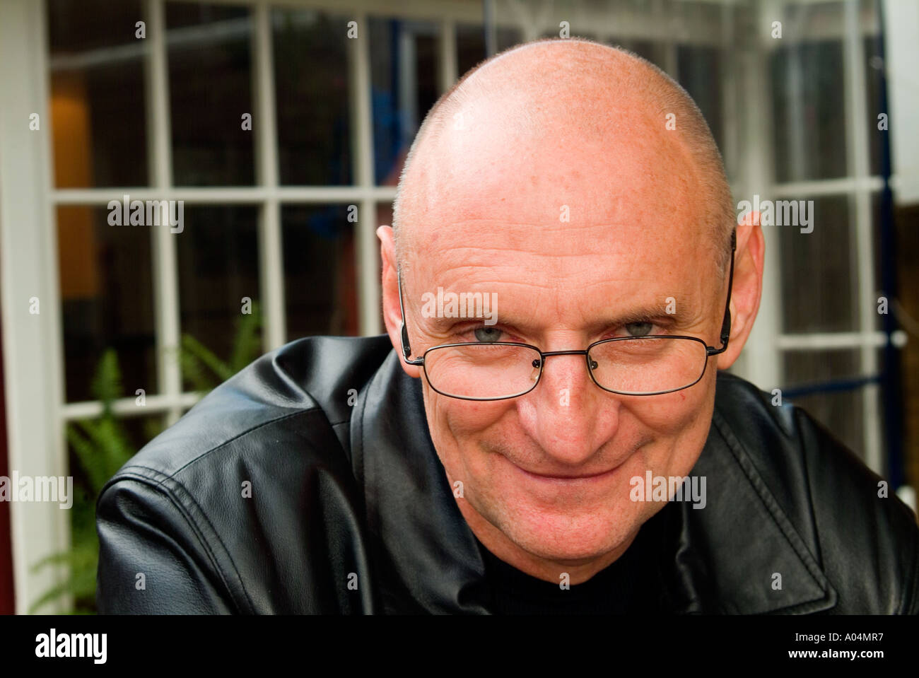 Cool looking older man with shaven head Stock Photo