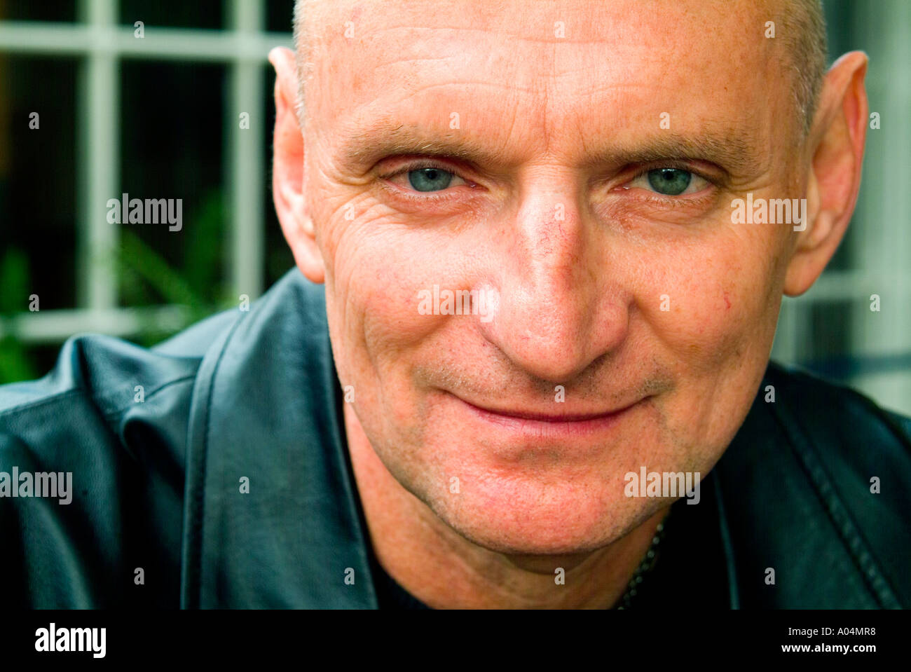 Cool looking older man with shaven head Stock Photo