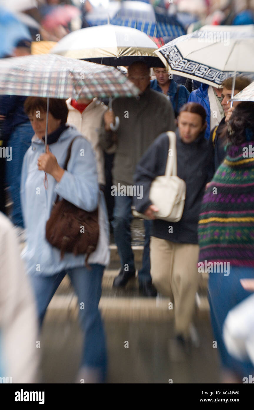 Pedestrians carry umbrellas hi-res stock photography and images - Alamy