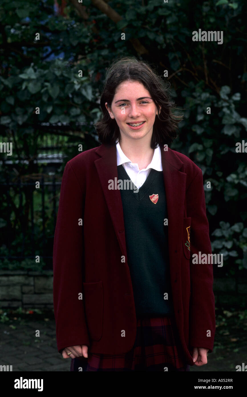 Life in Ireland school girl age 15 in traditional uniform in Ennis