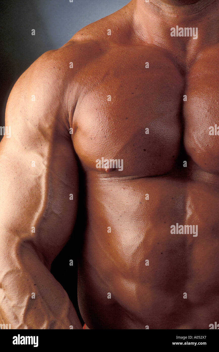 muscular muscle man with big pectoral muscles and bulging biceps Stock Photo picture
