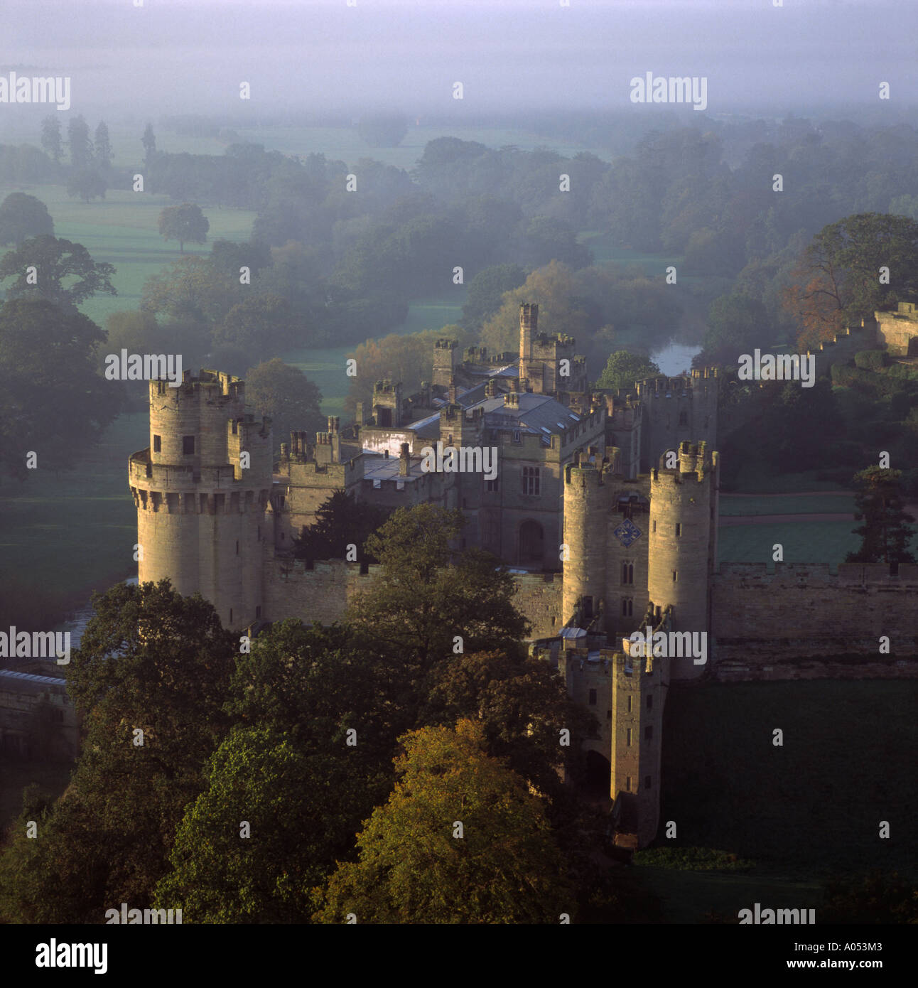 Misty autumn morning Warwick castle and River Avon UK aerial view Stock Photo