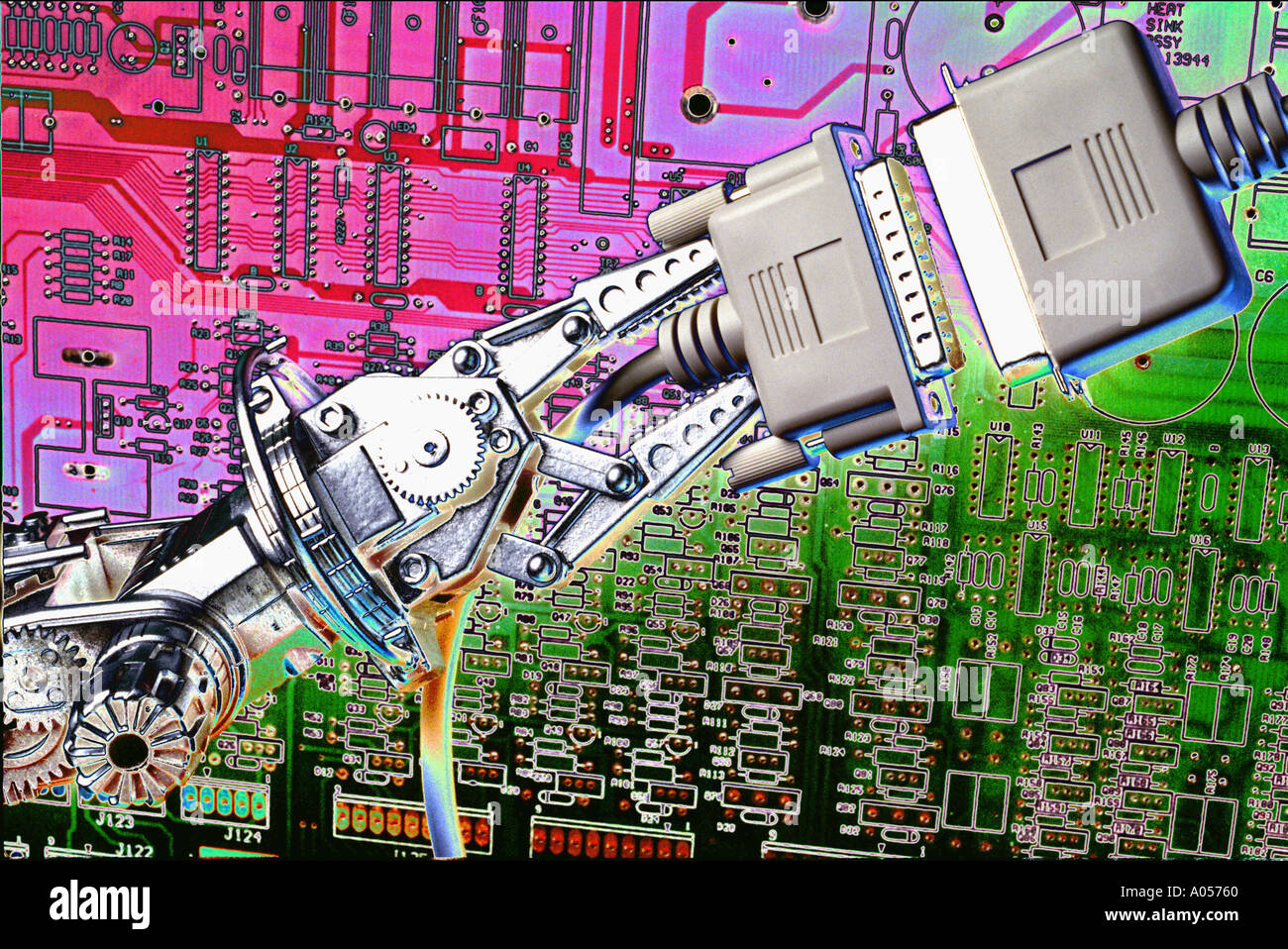 robotic arm making computer plugs connection Stock Photo